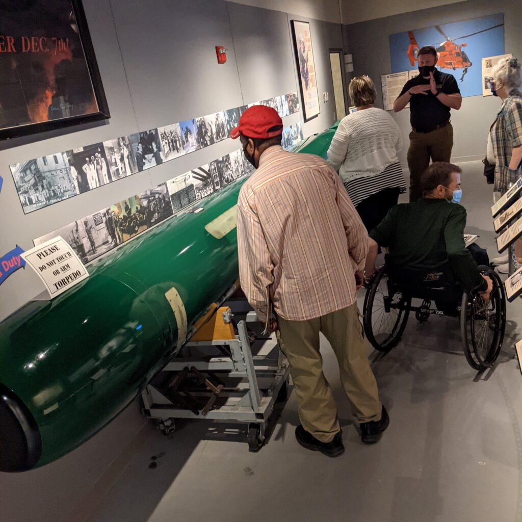 Visitors explore the Sea Power gallery at the Pennsylvania Military Museum in Boalsburg, PA